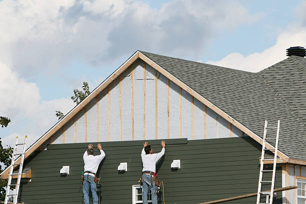 Professional Storm Damage Siding Repair technician working in West Islip, NY